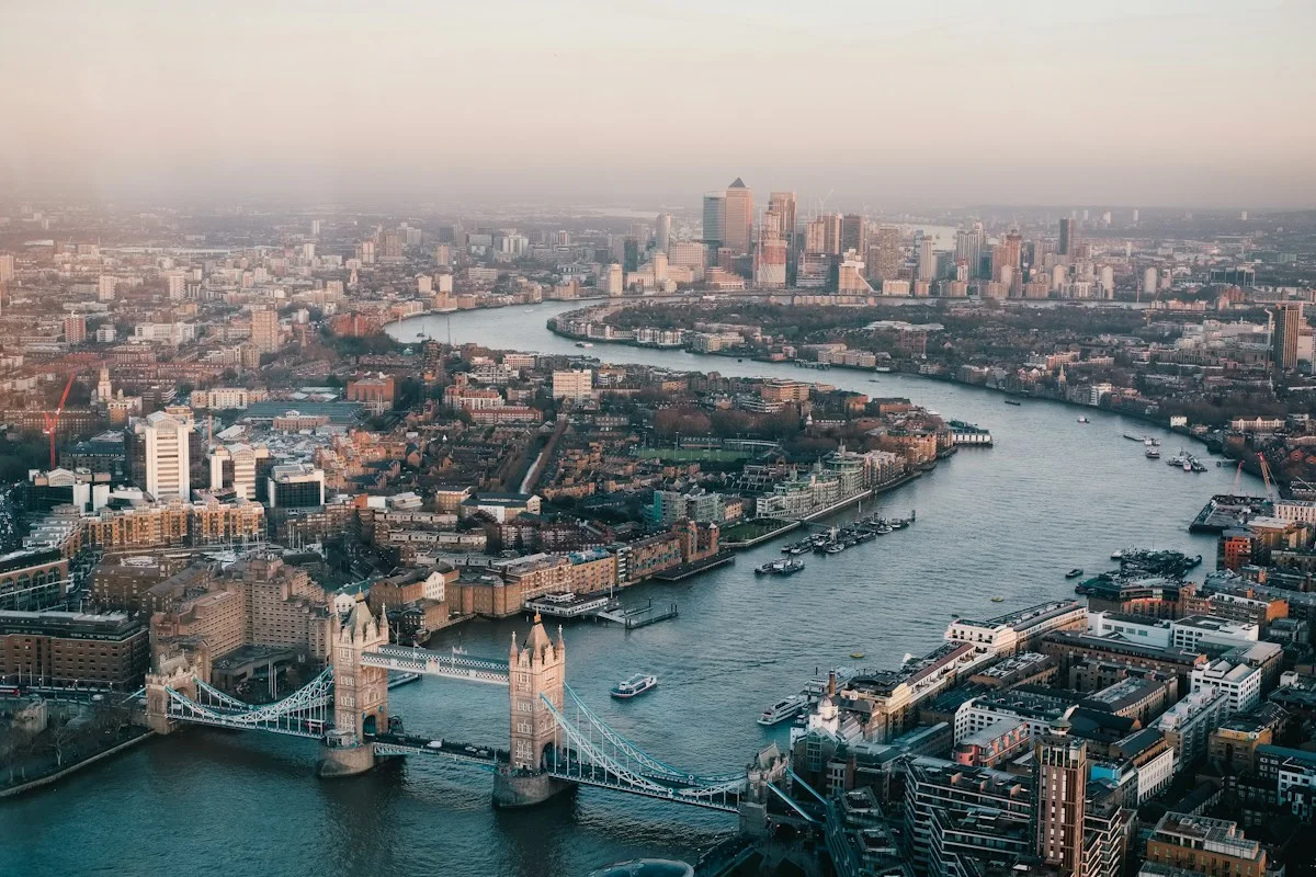 Aerial view over the River Thames and London buildings